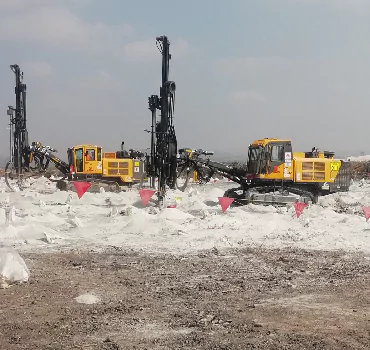 Opencast mining drill rig in action